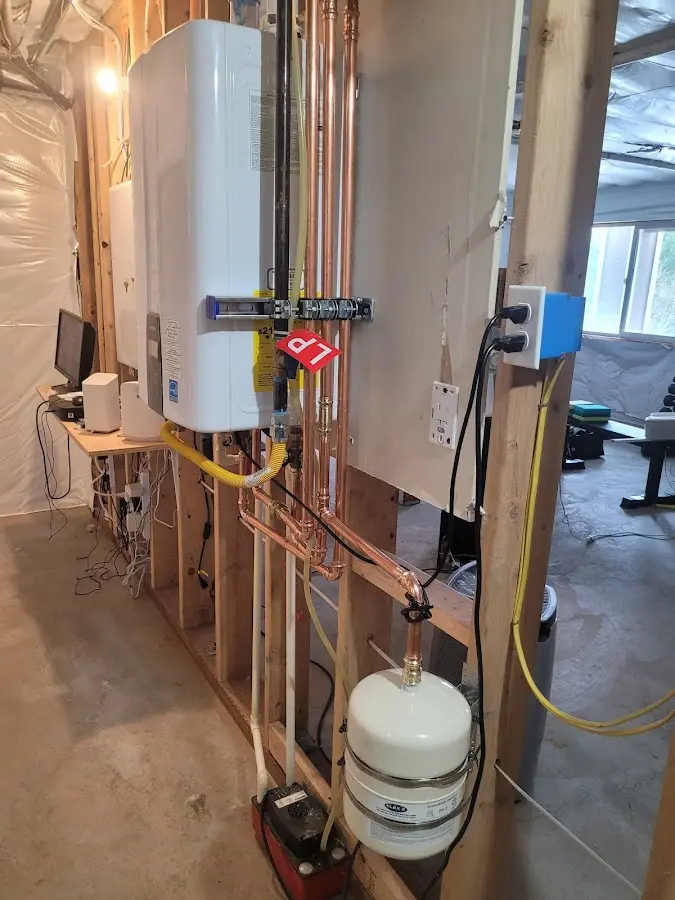 Licensed plumber repairing a kitchen sink in Navarre
